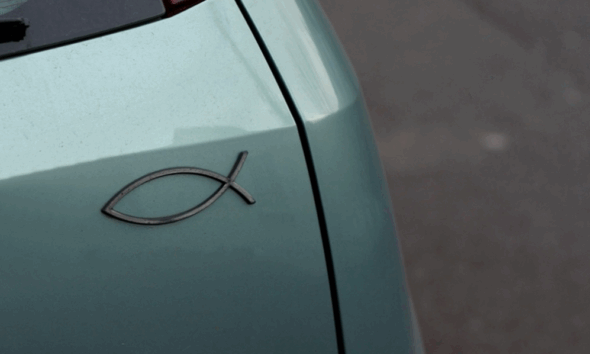 a close-up of a fish symbol on a car