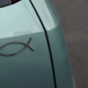 a close-up of a fish symbol on a car