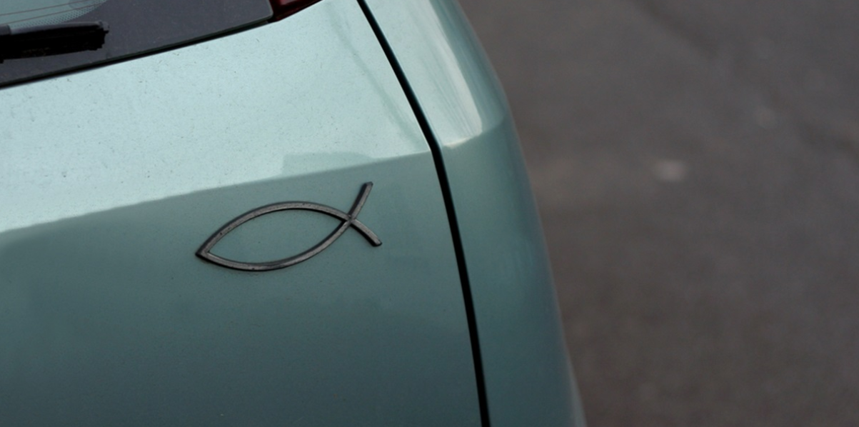 a close-up of a fish symbol on a car